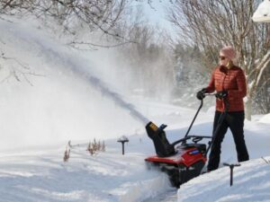 Woman using snow-remover